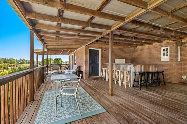 wooden terrace featuring an outdoor bar