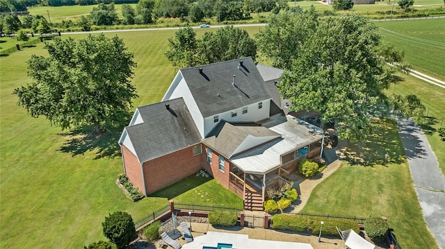 birds eye view of property with a rural view