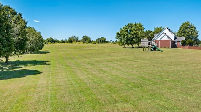 view of yard featuring a playground and a rural view