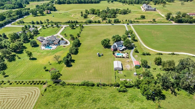 birds eye view of property with a rural view