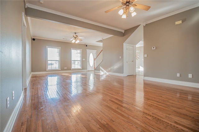 unfurnished living room featuring ceiling fan, ornamental molding, and light wood-type flooring