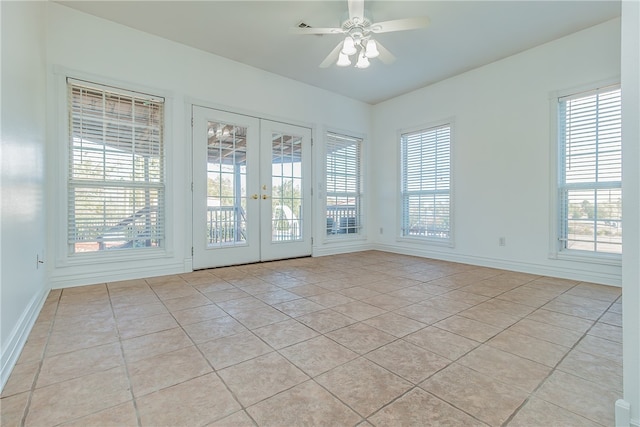 unfurnished room featuring light tile patterned flooring, ceiling fan, and french doors