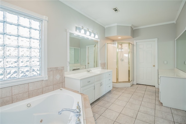 bathroom with tile patterned floors, ornamental molding, vanity, and a wealth of natural light