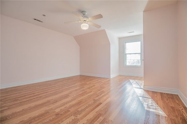 bonus room featuring ceiling fan and light wood-type flooring