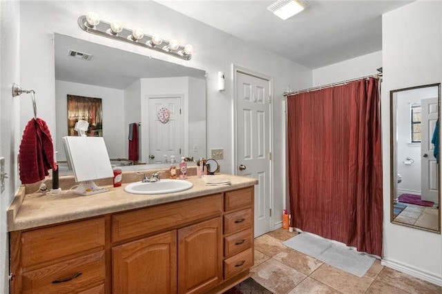 bathroom with vanity and tile patterned floors