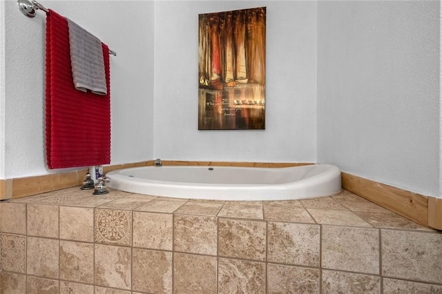 bathroom featuring tiled bath