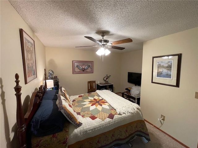 carpeted bedroom with a textured ceiling and ceiling fan