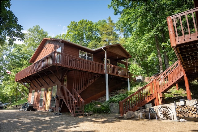 view of property exterior featuring a wooden deck