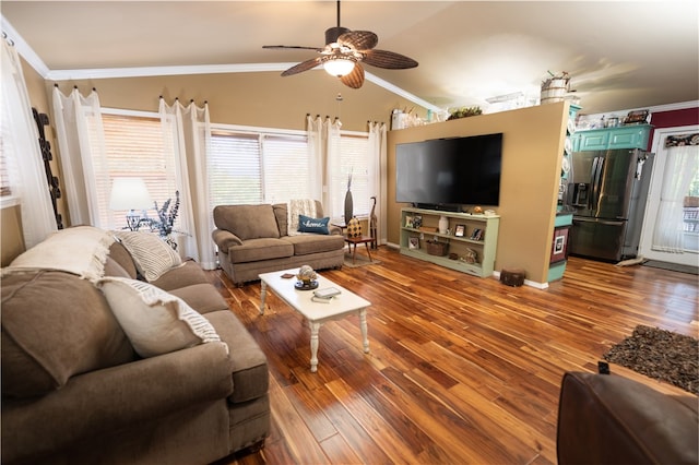 living room featuring wood-type flooring, lofted ceiling, ornamental molding, and ceiling fan