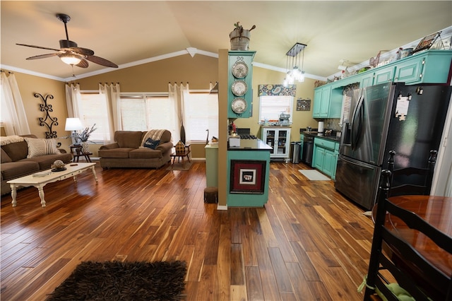 kitchen with ornamental molding, stainless steel fridge, dark hardwood / wood-style flooring, and vaulted ceiling