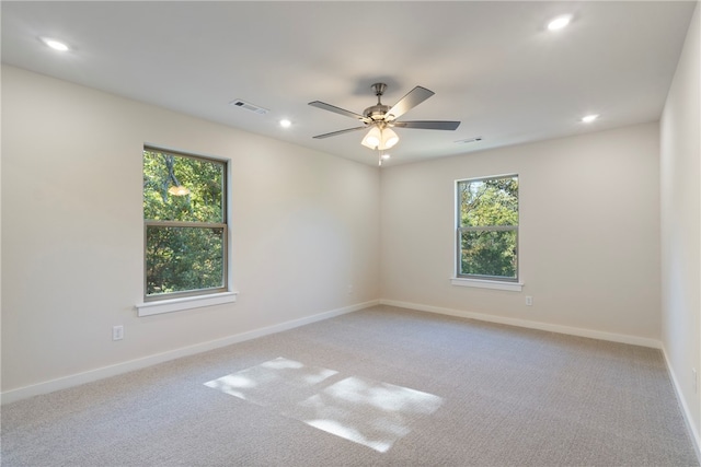 carpeted empty room with ceiling fan