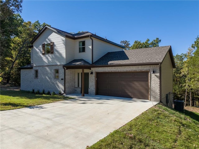 view of front facade with a garage and a front yard