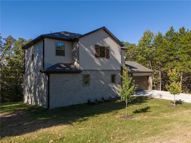 view of home's exterior featuring a garage and a yard