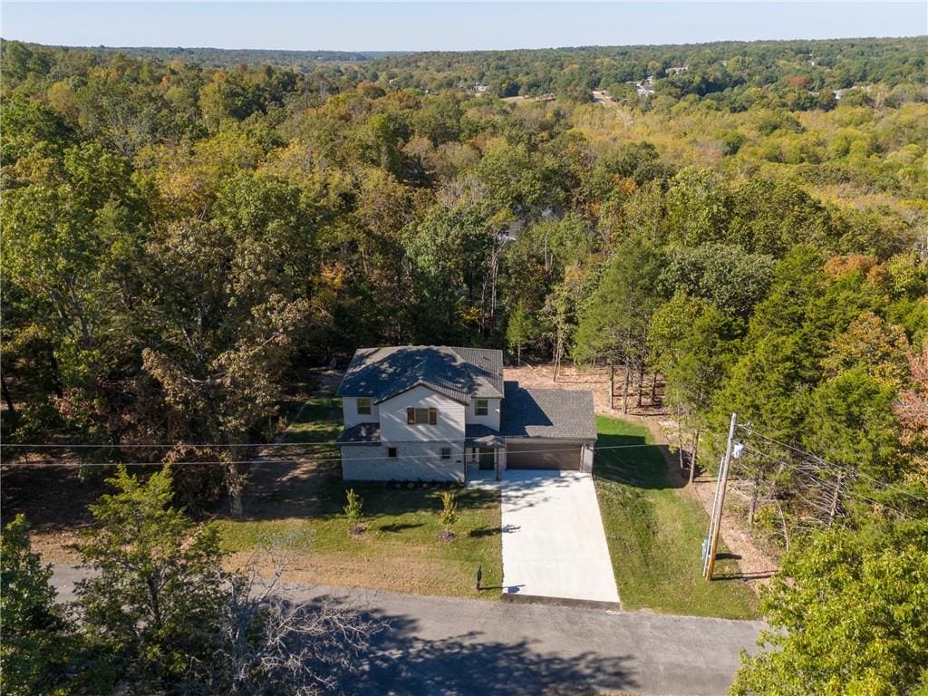 bird's eye view featuring a view of trees