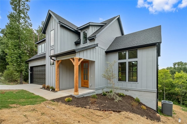 modern inspired farmhouse with central AC and a garage