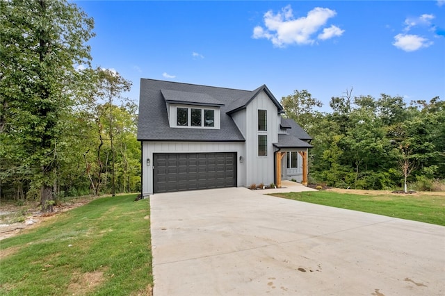 view of front facade with a garage and a front lawn