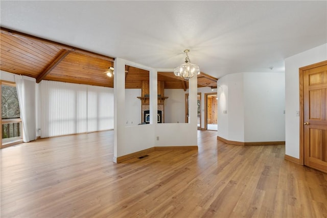 unfurnished living room featuring ceiling fan with notable chandelier, vaulted ceiling, wooden ceiling, a fireplace, and light hardwood / wood-style floors