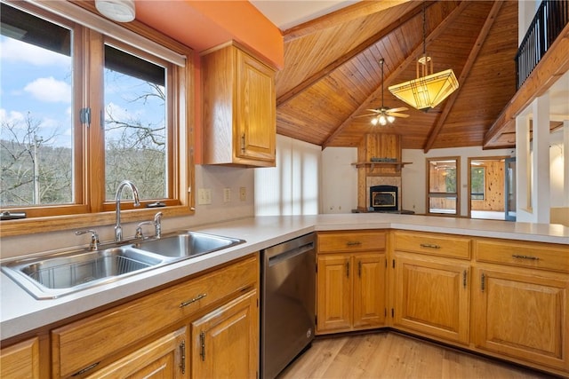 kitchen with dishwasher, pendant lighting, kitchen peninsula, and a wealth of natural light