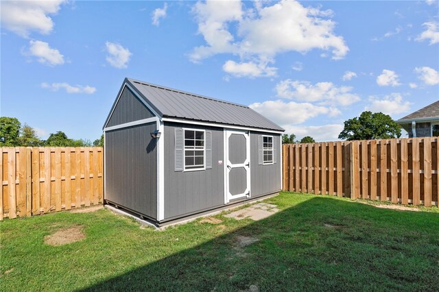 view of outdoor structure with a lawn