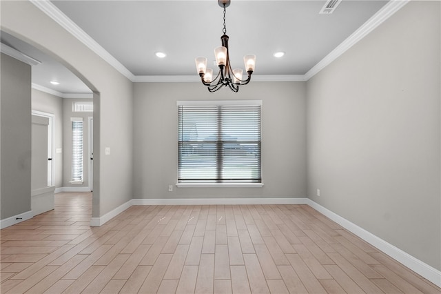 unfurnished room featuring light wood-type flooring, a chandelier, and crown molding