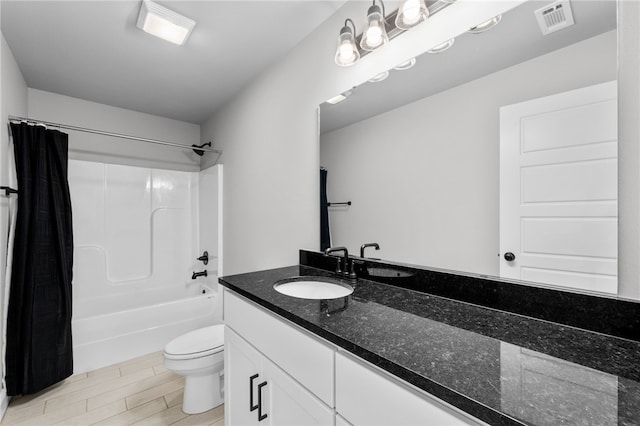 full bathroom featuring vanity, toilet, shower / tub combo with curtain, and tile patterned floors