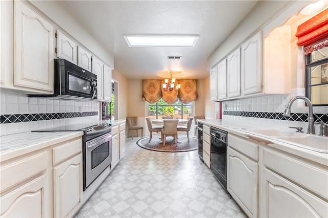 kitchen featuring a notable chandelier, black appliances, backsplash, and light tile patterned floors