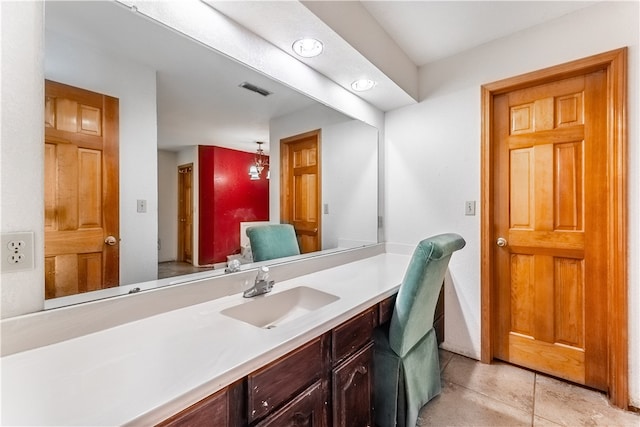 bathroom featuring tile patterned flooring and vanity