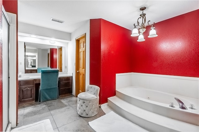 bathroom featuring vanity, tile patterned flooring, and a washtub