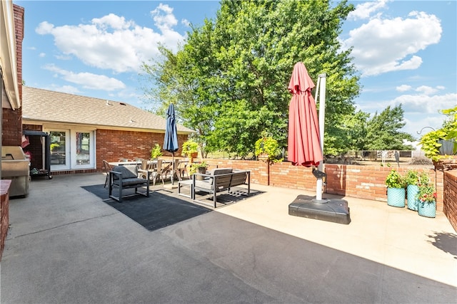 view of patio / terrace featuring grilling area, french doors, and an outdoor hangout area