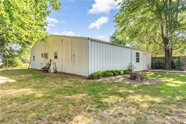 view of outbuilding with a yard