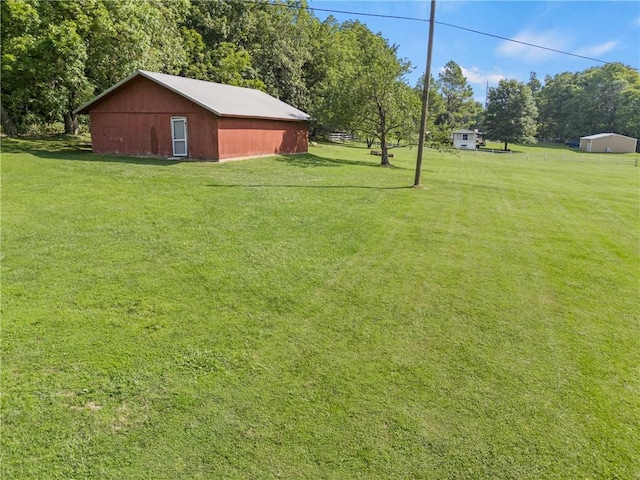 view of yard featuring an outbuilding and an outdoor structure