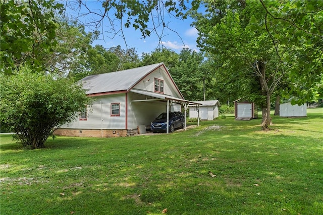 view of yard with a carport and a shed