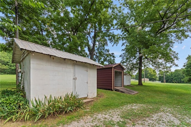 view of outbuilding featuring a lawn