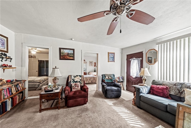 living room featuring a textured ceiling and carpet floors