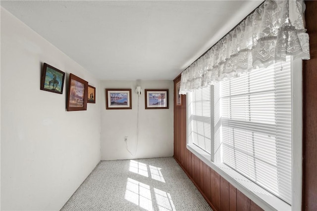 unfurnished room with light speckled floor