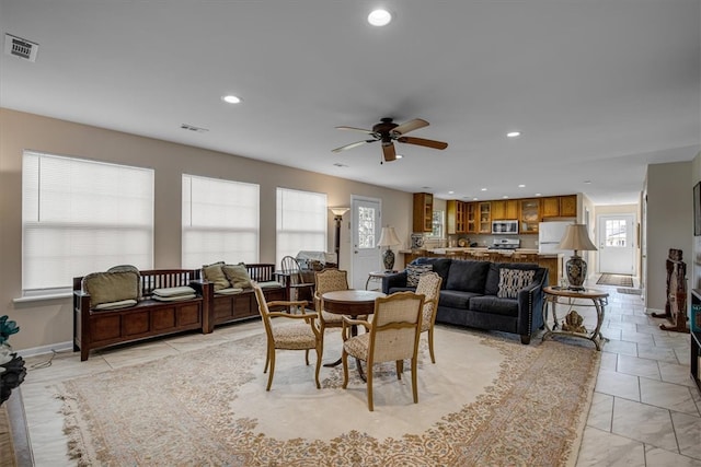 dining room featuring light tile patterned floors and ceiling fan