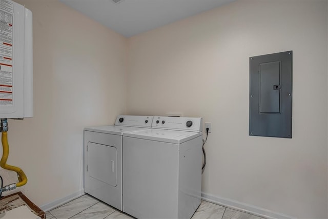 laundry room featuring water heater, washing machine and dryer, electric panel, and light tile patterned floors