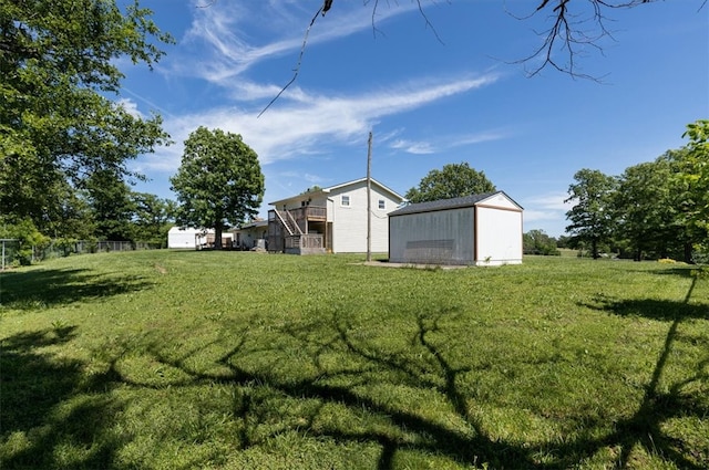 view of yard with a storage unit