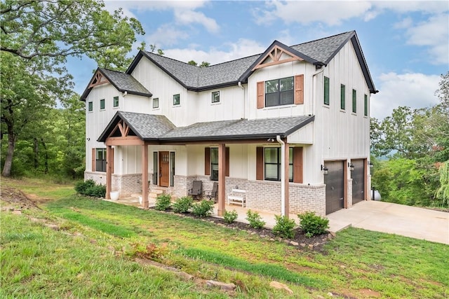 modern farmhouse style home with roof with shingles, a porch, concrete driveway, an attached garage, and board and batten siding