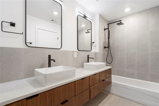406 SE G St, Bentonville, AR 72712 - bathroom featuring a sink, visible vents, double vanity, and tile patterned floors