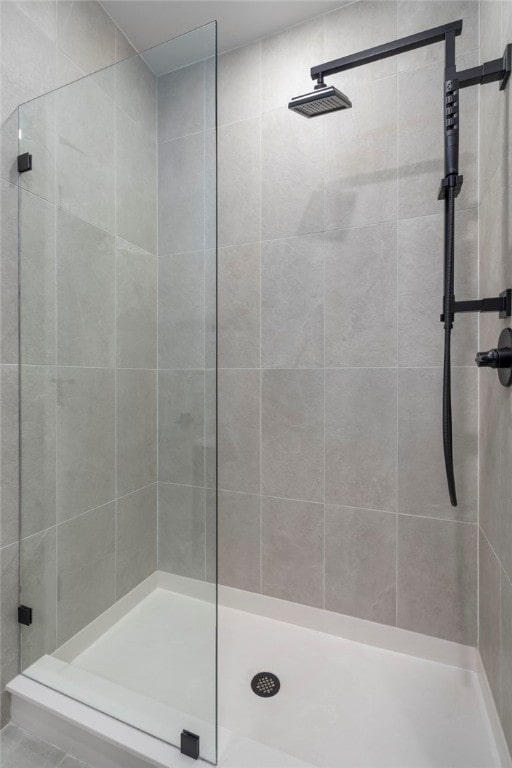 full bath featuring a shower stall