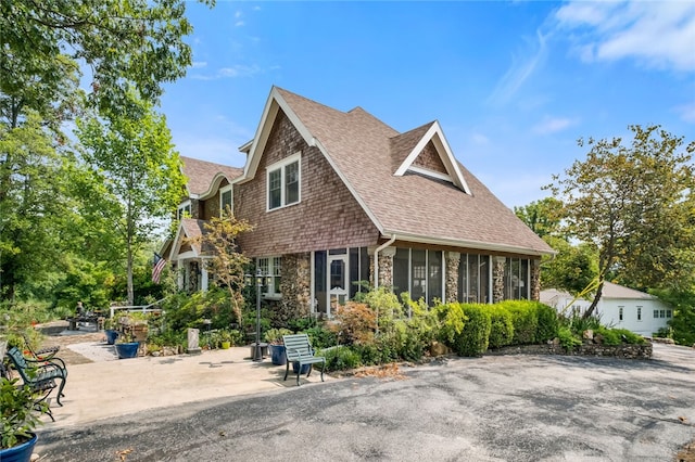 view of front of property with a sunroom