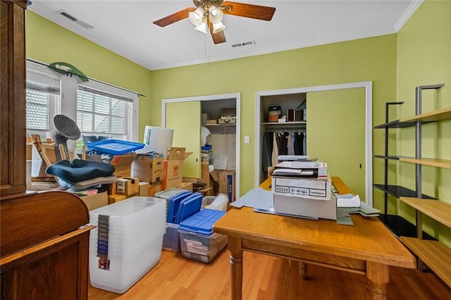 office space with crown molding, hardwood / wood-style floors, and ceiling fan