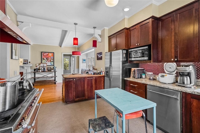 kitchen with pendant lighting, backsplash, light stone counters, stainless steel appliances, and wall chimney exhaust hood