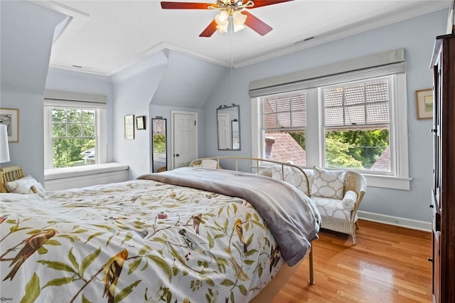 bedroom with crown molding, ceiling fan, and light hardwood / wood-style floors