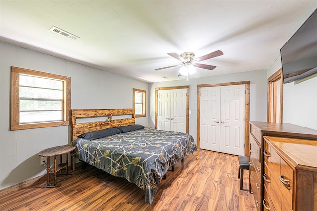 bedroom with hardwood / wood-style flooring and ceiling fan