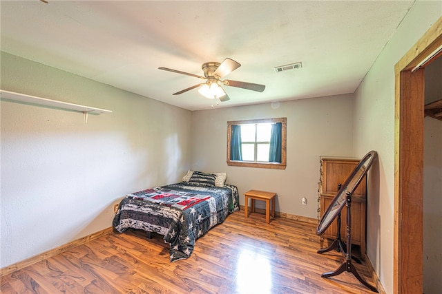 bedroom featuring wood-type flooring and ceiling fan