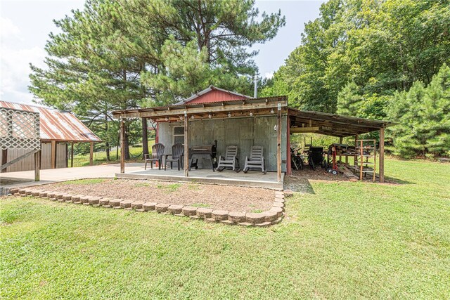 exterior space featuring a patio area and an outdoor structure