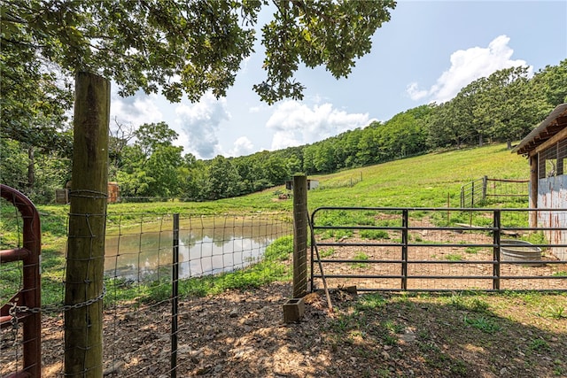 view of gate featuring a water view