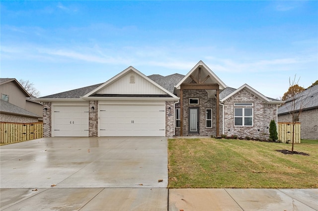 view of front facade with a garage and a front yard